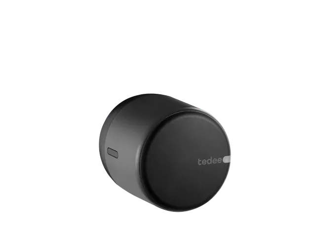 Serrure connectée Tedee Go noire, boîtier cylindrique au logo tedee